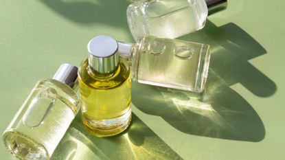 a picture of perfumes on a green background - pistachio perfume