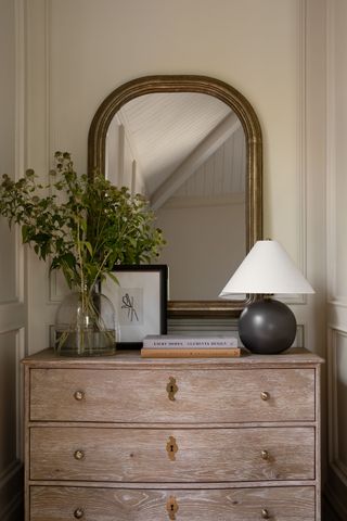 a dresser in a bedroom