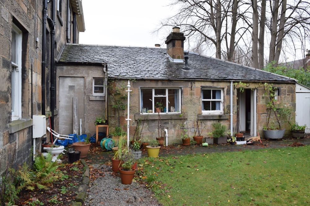 Existing uPVC gutters and downpipes were replaced with black aluminium ones.