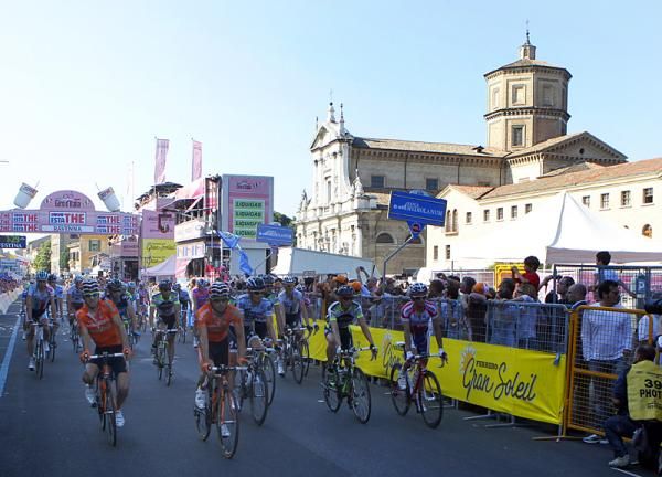 The peloton rolls across the finish line