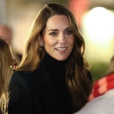 Kate Middleton attending the Ever After Garden illumination wearing a daisy earrings
