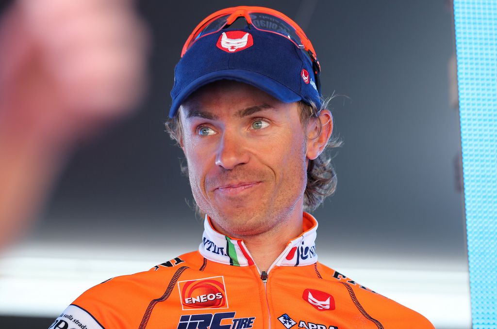 Damiano Cunego on the podium to collect the KOM jersey for another day