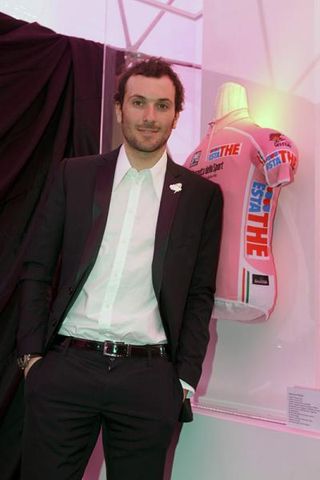 Ivan Basso poses with the 2010 Giro d'Italia leader's jersey.