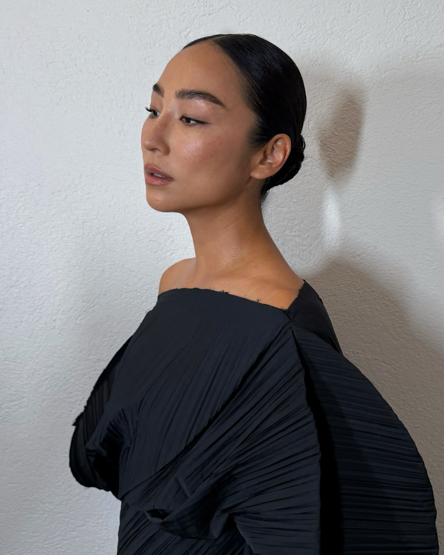A photo of Greta Lee with natural-looking makeup