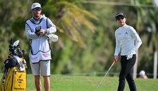 Lydia Ko and her caddie chat during the final round of the LPGA Drive On Championship