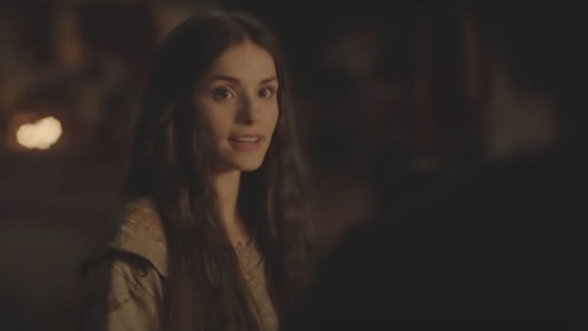 Charlotte Riley stands in mid-conversation in World Without End.