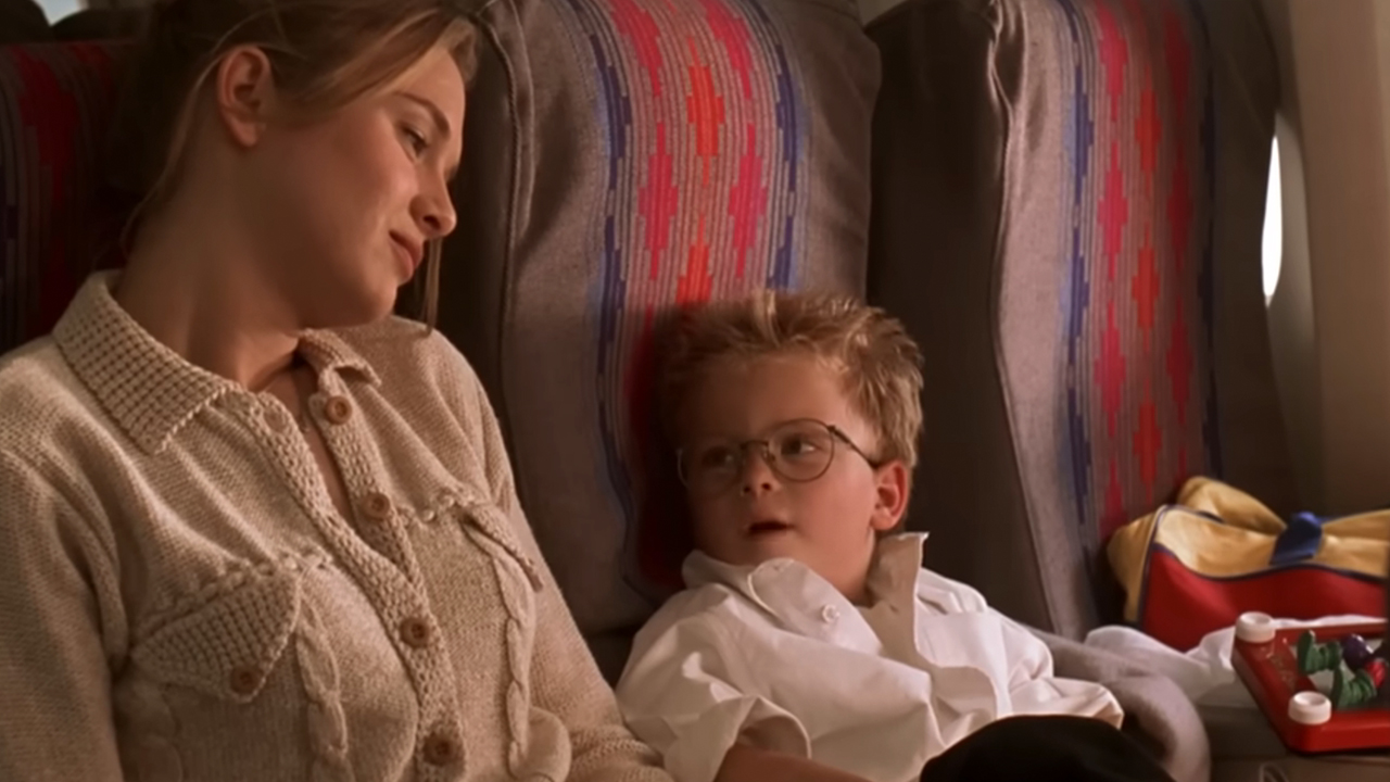 Ren&amp;eacute;e Zellweger and a boy in Jerry Maguire, sitting on a plane.