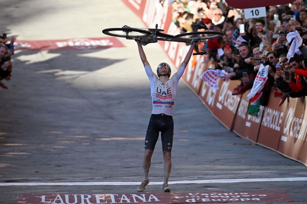 Tadej Pogacar celebrates his 2024 Strade Bianche victory in Siena