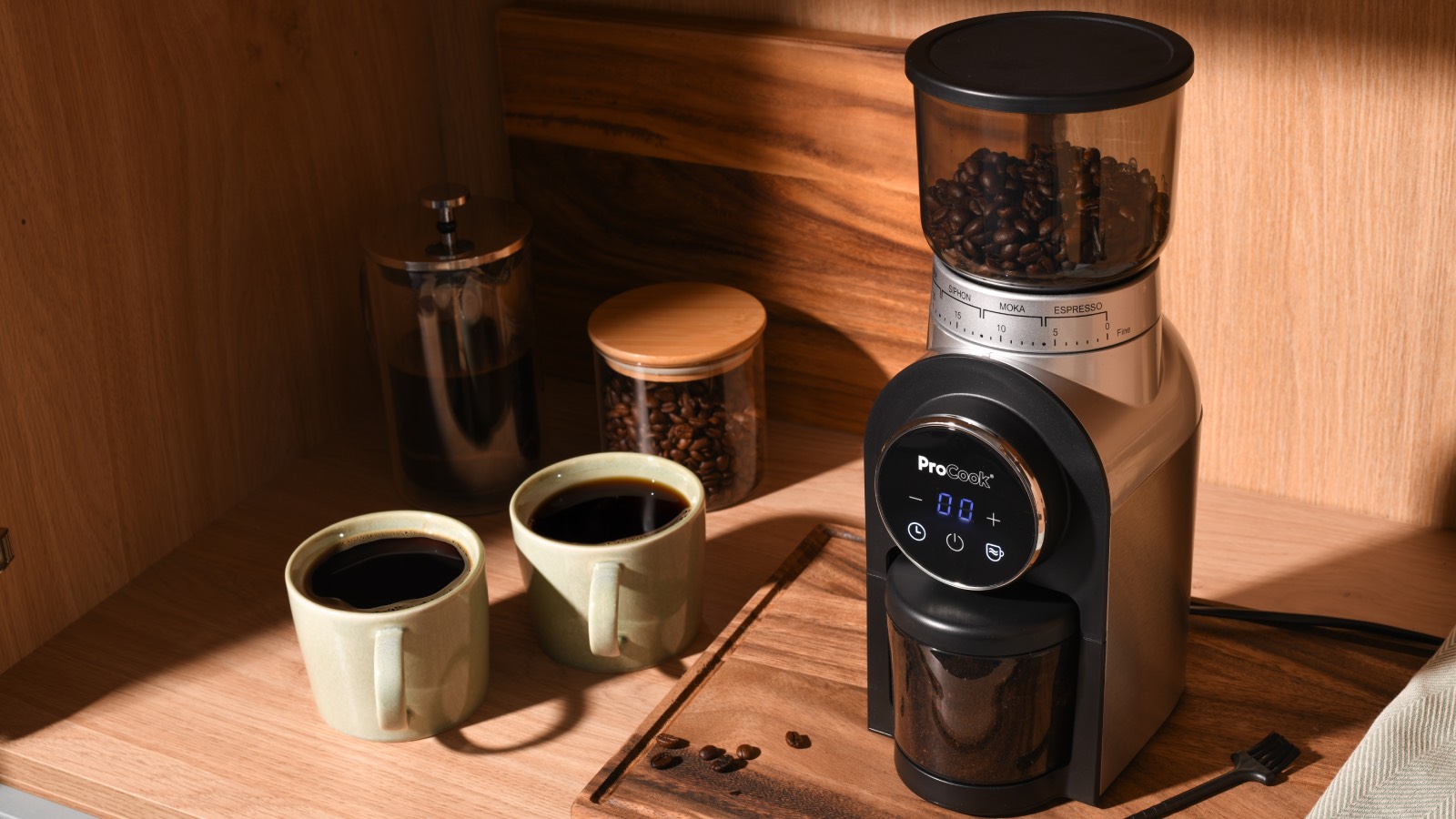 Procook burr grinder with two mugs of coffee