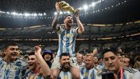 Lionel Messi of Argentina celebrates with the FIFA World Cup Qatar 2022 Winner's Trophy