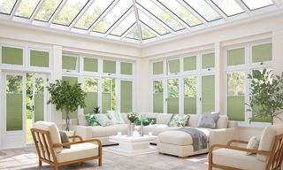 green blinds in conservatory living area