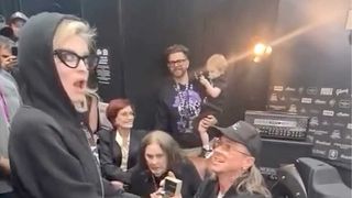 Sid Wilson proposing to a startled Kelly Osbourne as Sharon and Ozzy Osbourne look on