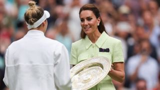 Kate Middleton hands over the Venus Rosewater Dish trophy to winner Marketa Vondrousova following her Women's Singles Final victory at Wimbledon 2023