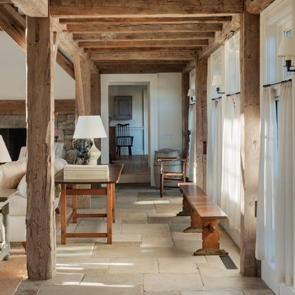 house with tiled flooring wooden pillars