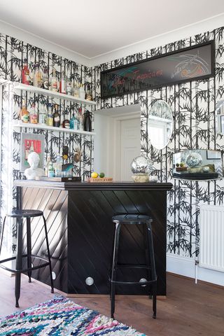 Home bar with bold patterned wallpaper