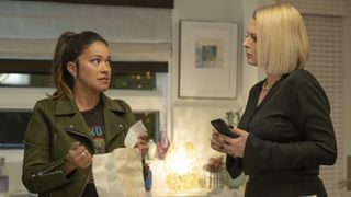 Gina Rodriguez and Lauren Ash as Nell and Lexi in a conversation in Not Dead Yet season 2