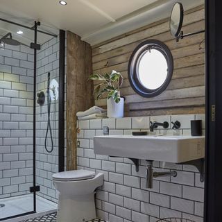 bathroom with metro tiles and porthole window