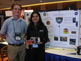 Drexel University Space Systems Lab students Kenneth Mallory and Swati Maini showcase their smallsat at last month’s Small Satellite Conference in Logan, Utah.