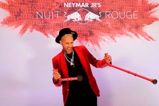 Paris Saint-Germain's Brazilian forward Neymar poses with his crutches as he arrives at his birthday party in Paris on February 4, 2019.