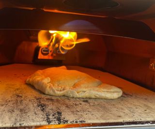 A calzone baking in the Ooni Karu 2 Pro