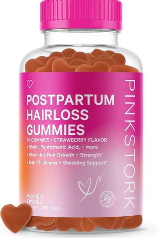 bottle of hair growth gummy vitamins