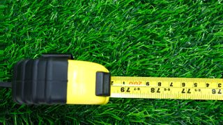 A measuring tape in the grass