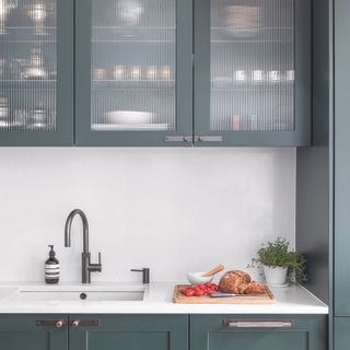Kitchen with glass cabinet with reeded glass