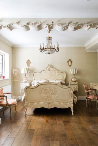 Cream french-style bedroom with wooden flooring