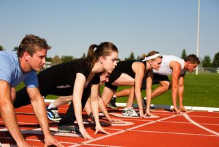 Teens line up to begin a track race.