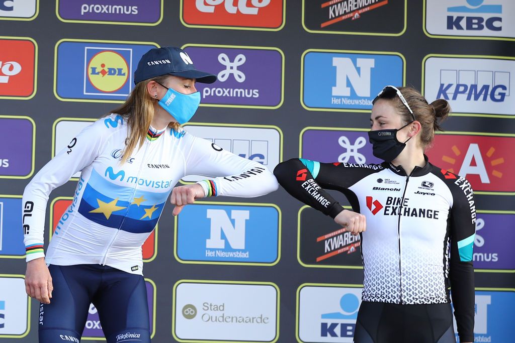 Dutch Annemiek van Vleuten of Movistar Team and Australian Grace Brown of Team Bikeexchange give a corona proof elbow bump as they celebrate on the podium after the womens edition of the Ronde van Vlaanderen Tour des Flandres Tour of Flanders one day cycling race 152km from and to Oudenaarde Sunday 04 April 2021BELGA PHOTO DAVID PINTENS Photo by David PintensBELGA MAGAFP via Getty Images
