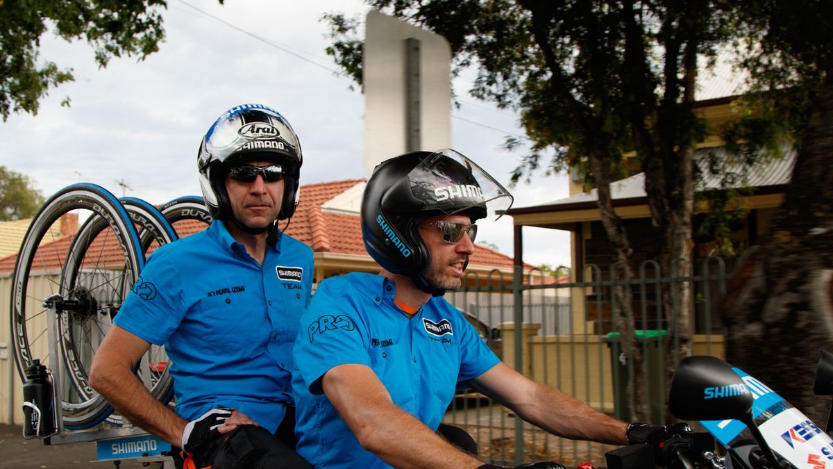 Feeling the heat of the day, Belgium's Tom Class (driving) and Patrick Dils provide support from the bike. Class is a motorbike police officer back home, while Dils is a wiper blade consultant at Bosch