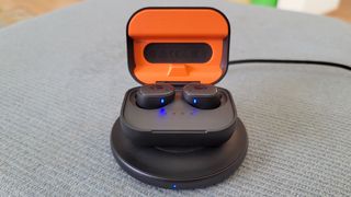 The Skullcandy Grind Fuel on a wireless charger