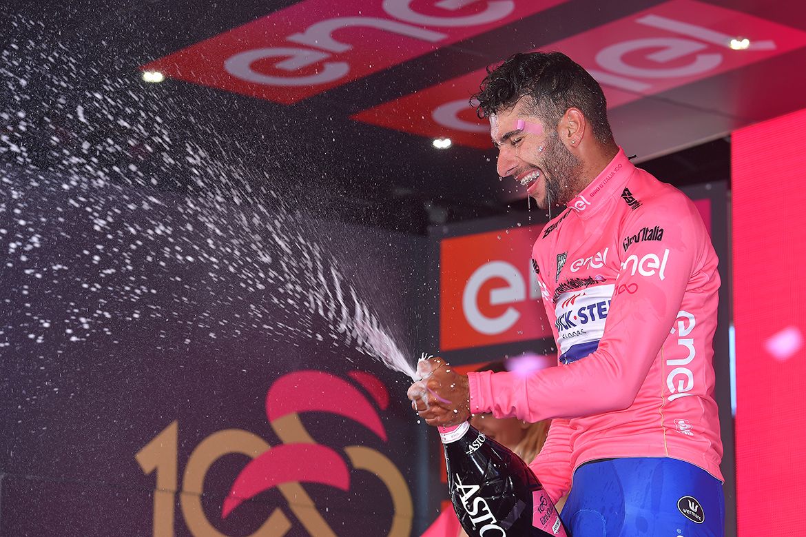 Fernando Gaviria celebrates a stage win and the pink jersey at the Giro d'Italia.