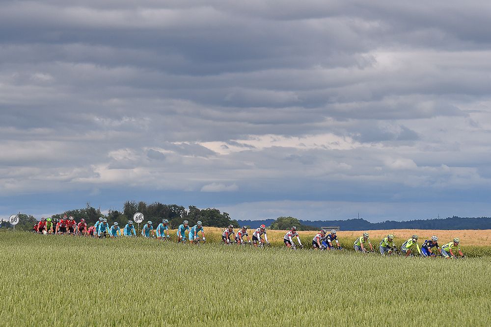 The peloton rolls through the countryside during stage 4 at the Tour de Suisse