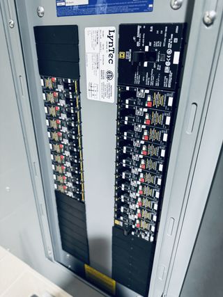 Distributing power and providing control over the audio, video, and lighting (AVL) system is a LynTec RPC329 Relay Panel with motorized breakers. Sixteen circuits are dedicated to house and theatrical lighting, while four of the panel's circuits power the audio rack, which is triggered with Furman sequencers.