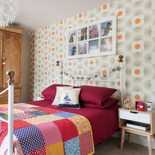 bedroom with wallpaper and bed