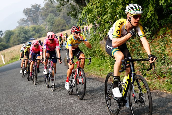 Sunweb&rsquo;s Jai Hindley, in the yellow jersey as race leader, takes on some fuel as hie follows Australian road race champion Cameron Meyer (Mitchelton-Scott)