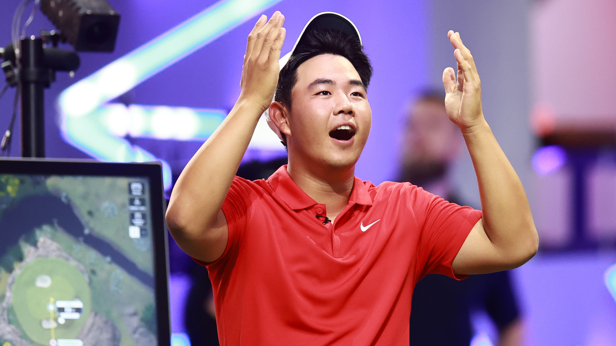 Tom Kim reacts to his hole-in-one during a TGL match in Florida.