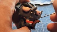 An image of an indie game developer working on a Clay model for the handmade video game Sculplings