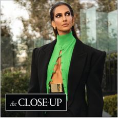 Poorna Jagannathan getting ready for the premiere of 'Lanterns' in L.A., wearing a black-and-green cool from Mugler.