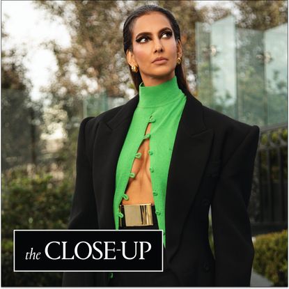 Poorna Jagannathan getting ready for the premiere of 'Lanterns' in L.A., wearing a black-and-green cool from Mugler.