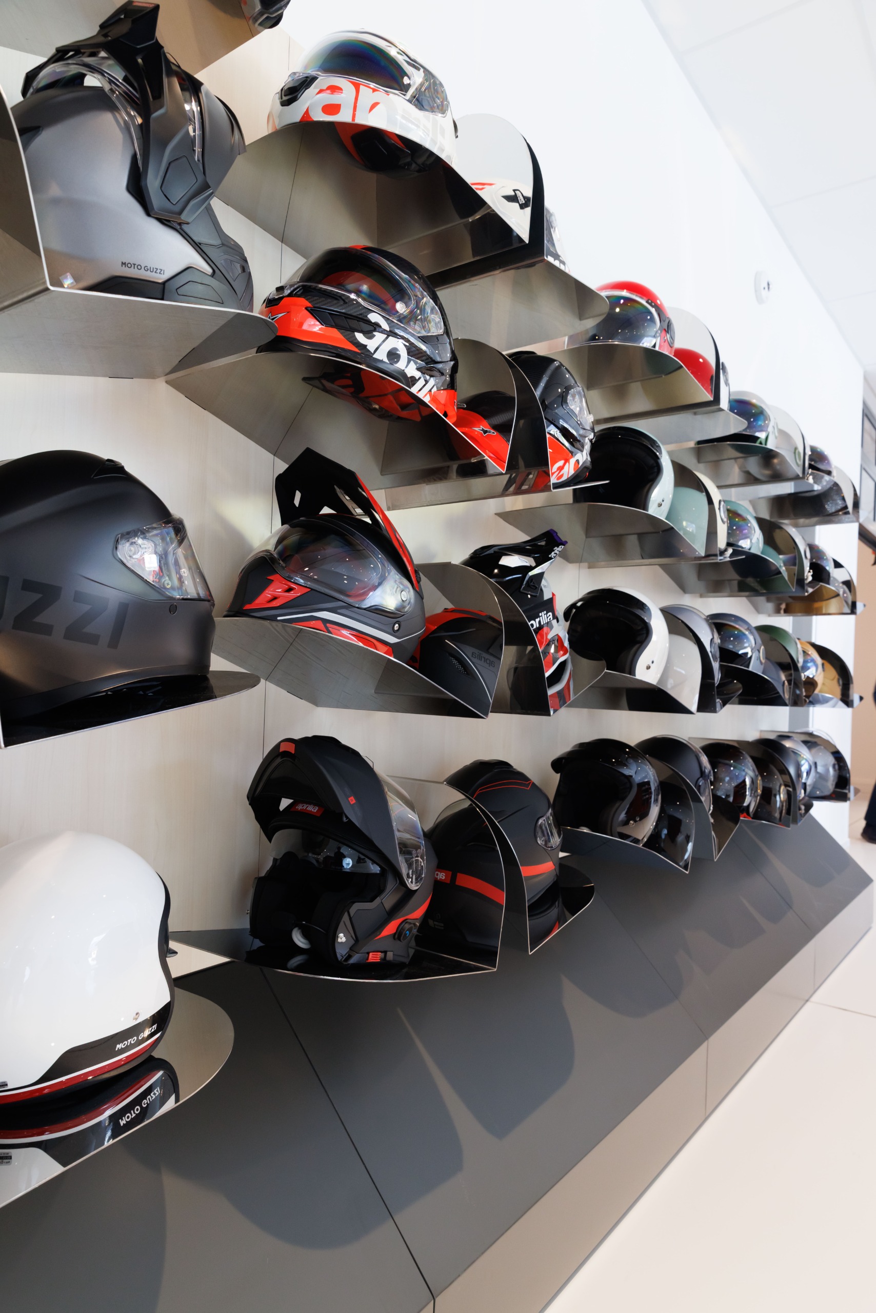 Display of helmets at Moto Guzzi museum and HQ, Mandello del Lario