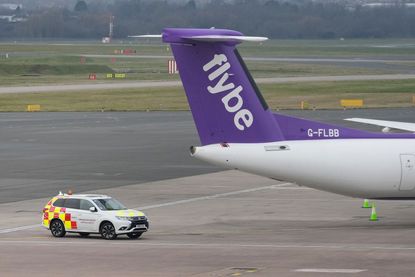 A Flybe aircraft sits on the tarmac at Birmingham Airport