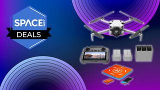 A four-propeller drone is sat above its accessories which include a remote controller and some rectangular batteries is on a purple background with disco circles.