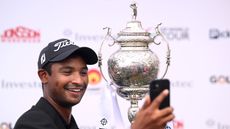 Dylan Naidoo takes a selfie alongside the 2025 South African Open Championship trophy