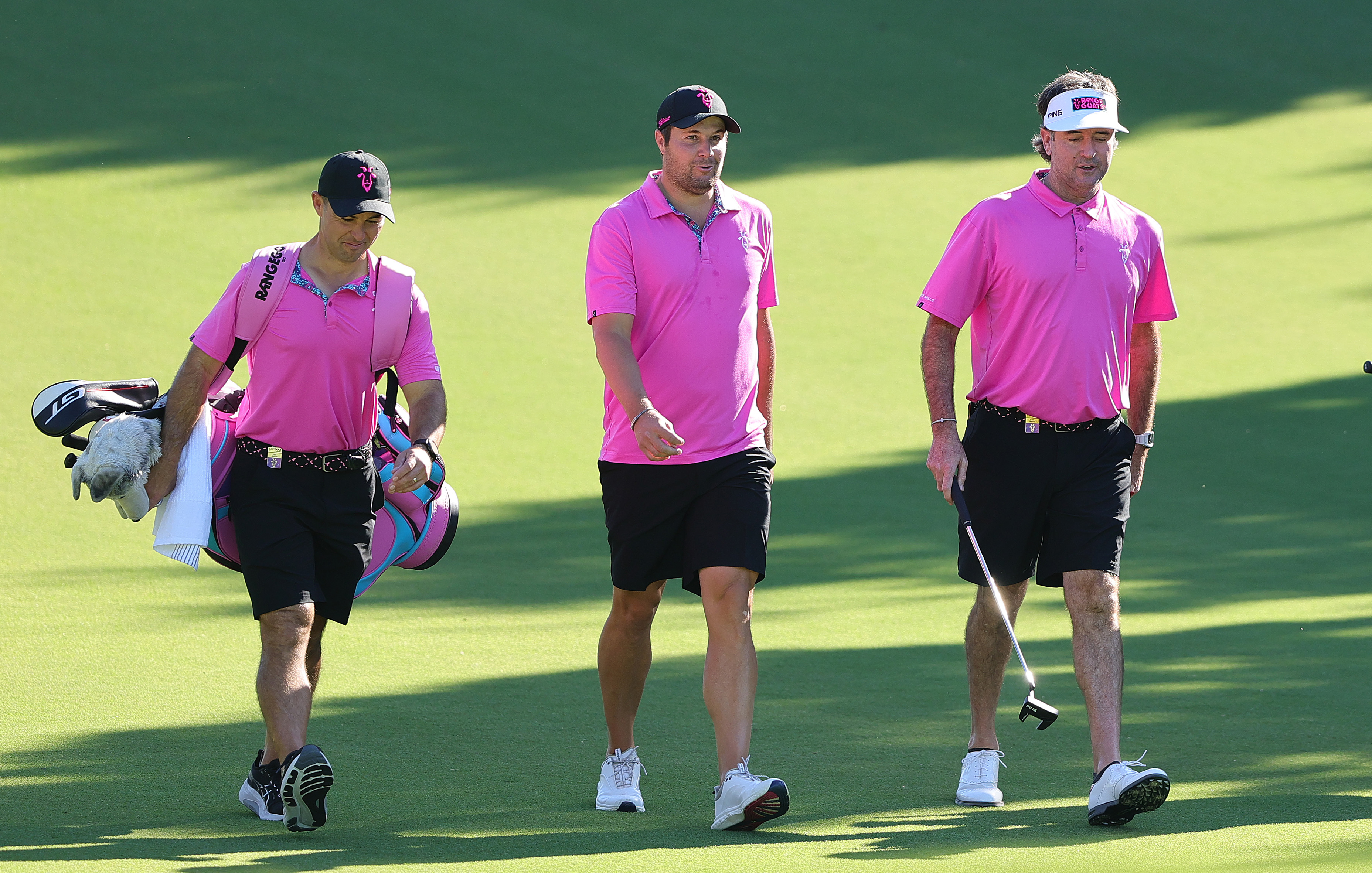Peter Uihlein and Bubba Watson walk on to the green