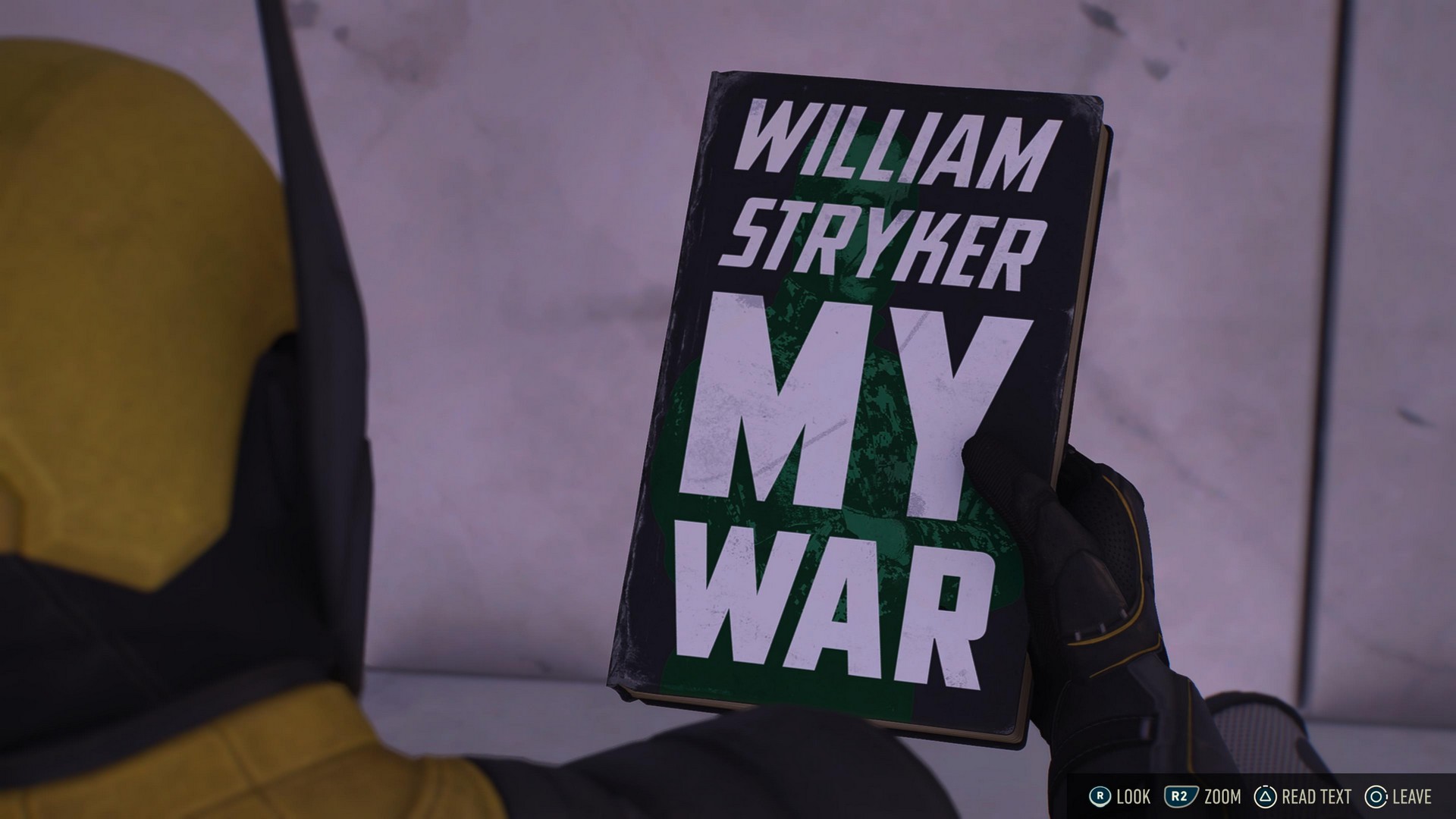 Logan holds William Stryker's autobiography 'My War' in Marvel's Wolverine