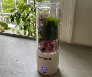 The ingredients for a smoothie in the Nutribullet Portable Blender