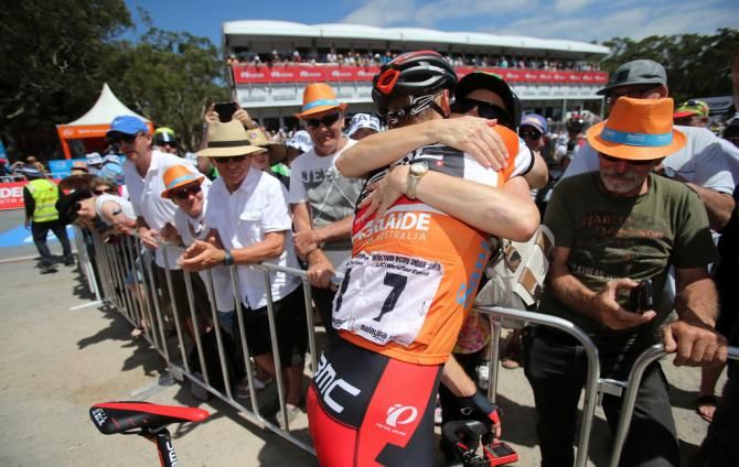 Rohan Dennis (BMC) hugs his mum on the top of Willunga Hill