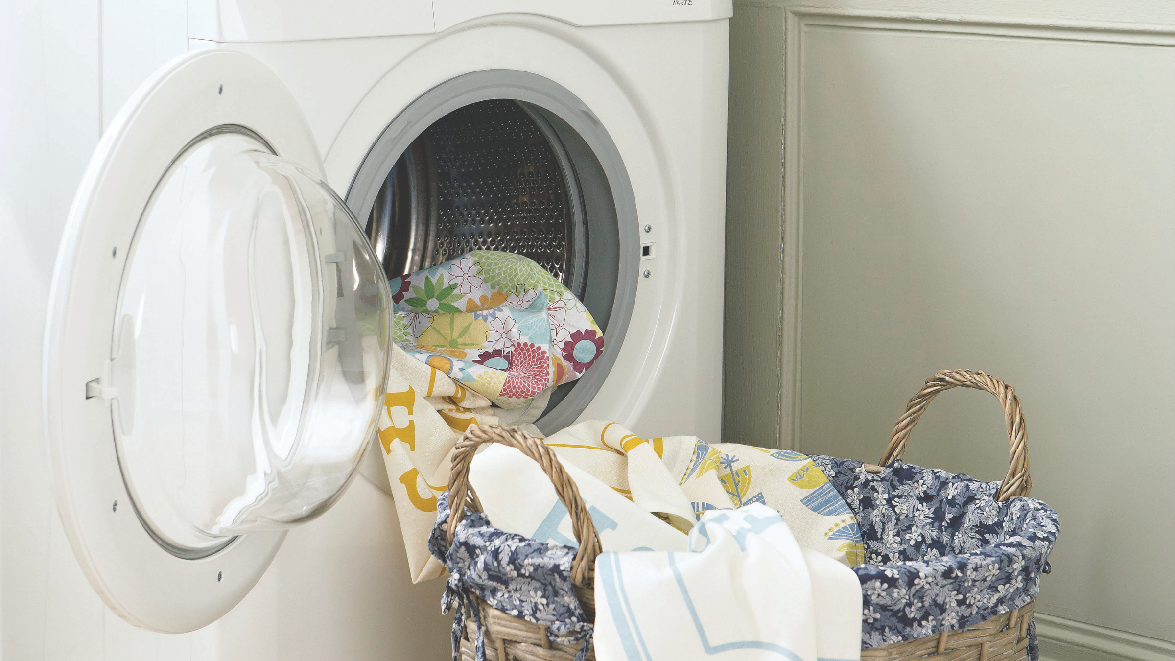 Close-up of washing coming out of a washing machine.
